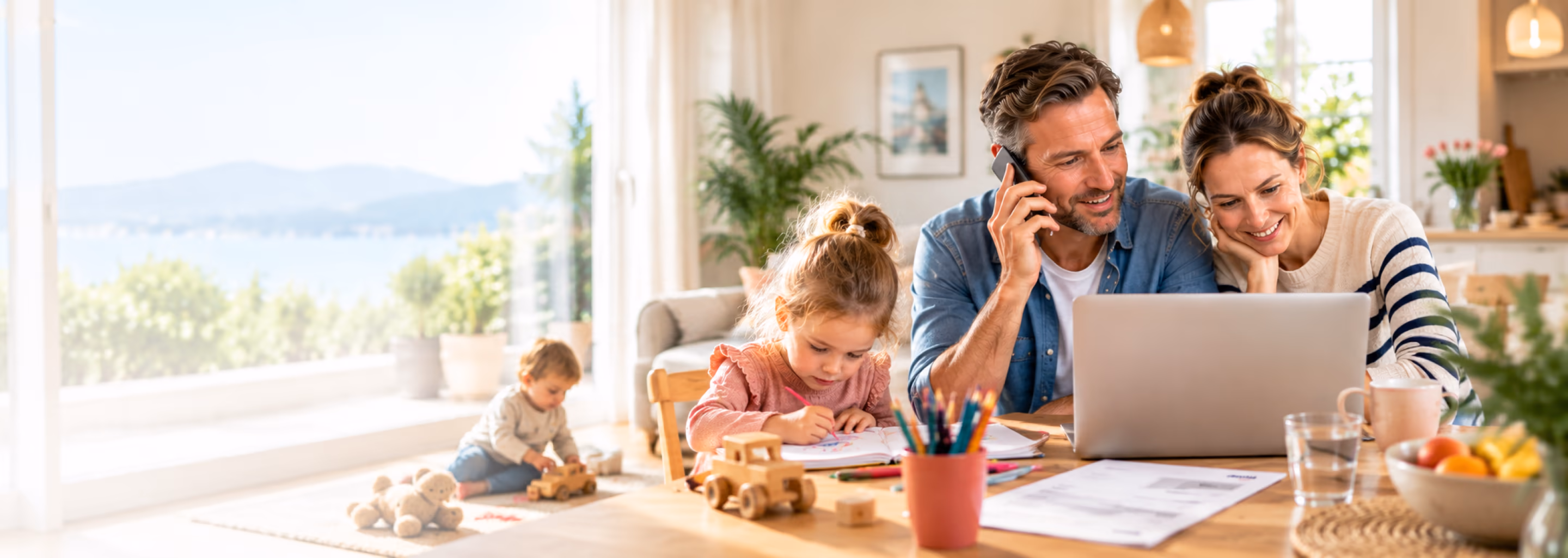 Family at home: the father is on the phone, the mother smiles at the laptop, the children draw and play
